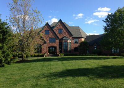 Large home with manicured lawn